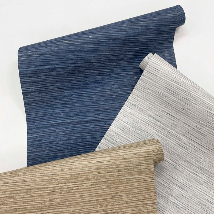 Rolls of stylish removable wallpaper in blue, white, and beige with textured horizontal stripe patterns on white background Rolls of stylish removable wallpaper in blue, white, and beige with textured horizontal stripe patterns on white background