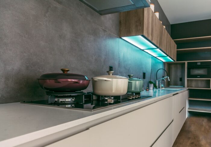 Kitchen with electric stove with cooking pots and task lights
