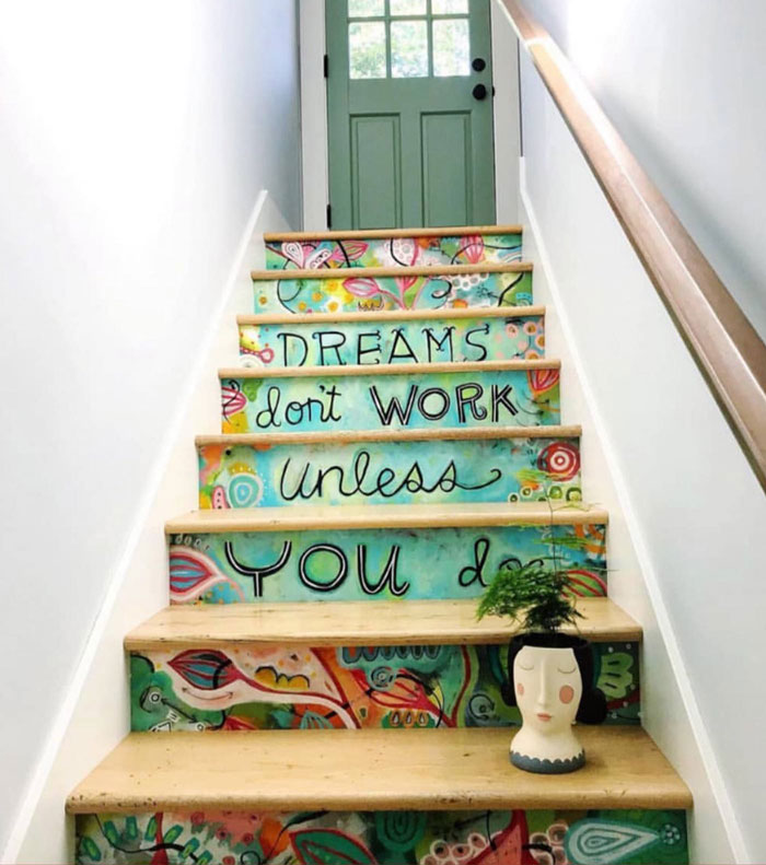 wooden colorful stairs with painted treads and wooden railing