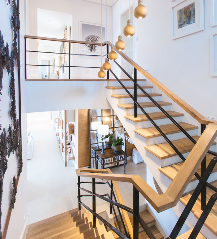 wooden and white winder stairs with wooden railings