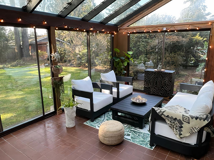 Spacious sunroom with Seagrass Poufs and Ottomans