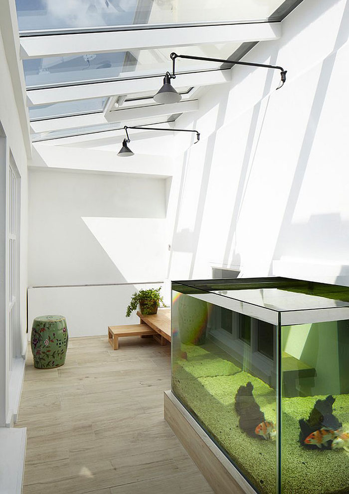 Cozy Bright Sunroom With A Big Fish Tank Inside