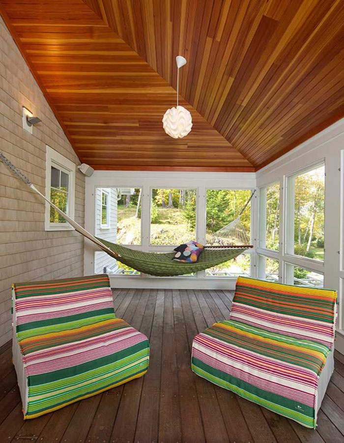 Colorful Vibrant Sunroom With A Hammock 
