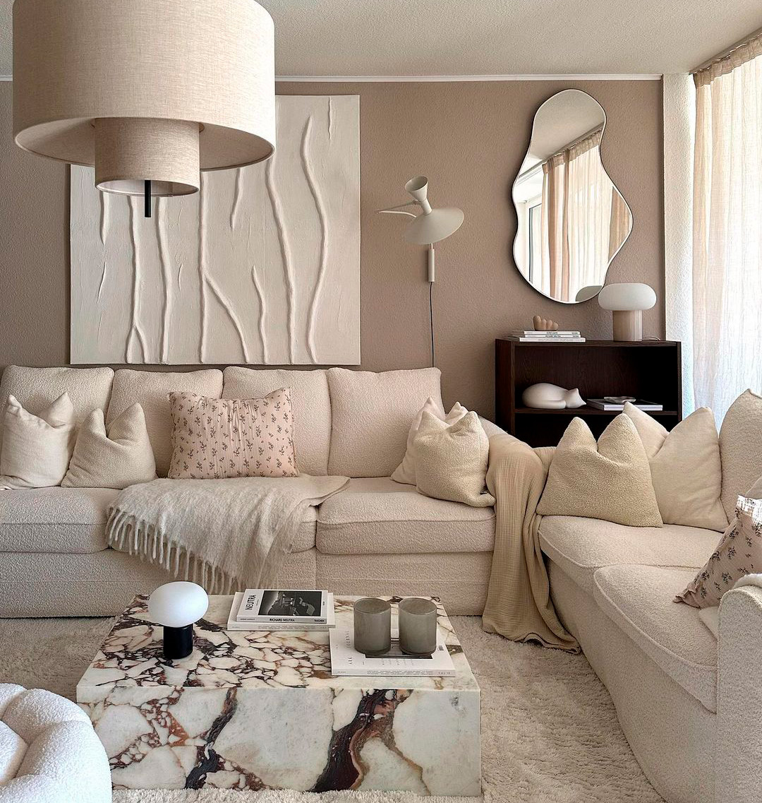 big beige sofa in the middle of the room in taupe colors