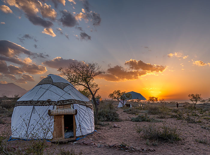 A yurt in the middle of a desert. 