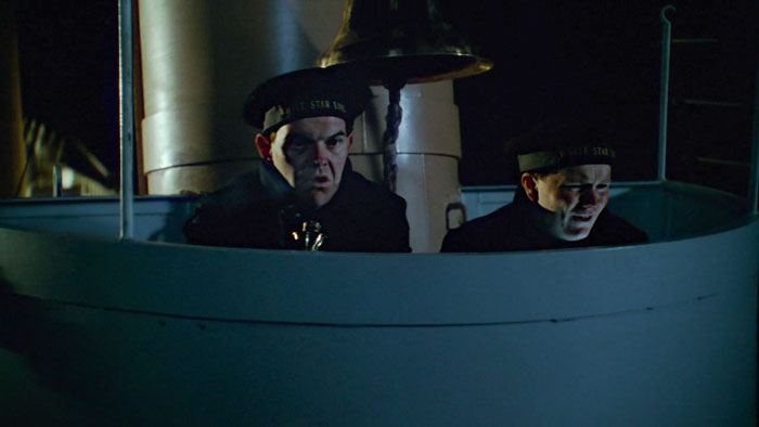 Titanic's lookouts in front of the alarm bell in the 'Titanic' (1997) movie