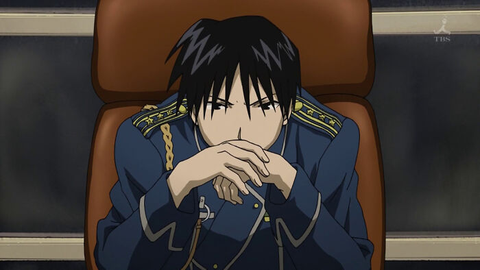 Roy Mustang from Full Metal Alchemist looking thoughtful