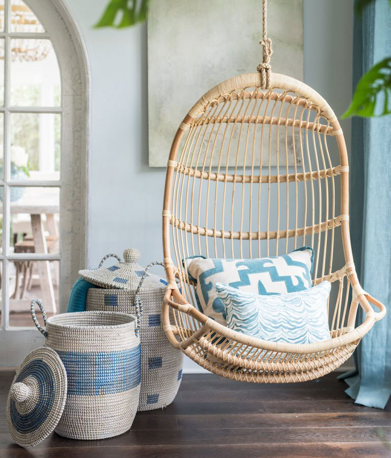 Bright Playful Sunroom With Rattan Swing Chair In A Corner