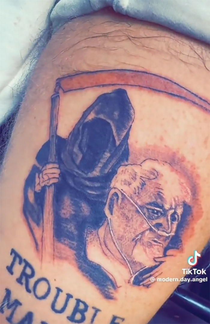 Tattoo of Grim Reaper with text on TikToker's leg, trolling bullies with viral prank. Tattoo of Grim Reaper with text on TikToker's leg, trolling bullies with viral prank.