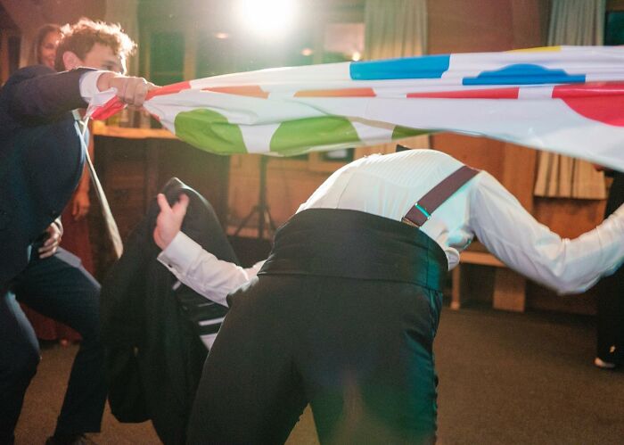 A Photograph Of People Playing During The Wedding Party