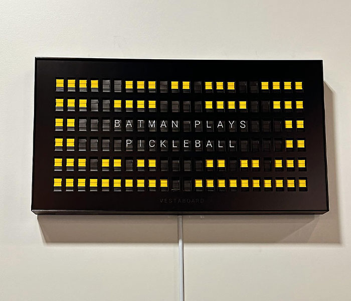 Vestaboard displaying "Batman plays pickleball," referencing Matthew Perry's mysterious Batman-themed posts. Vestaboard displaying "Batman plays pickleball," referencing Matthew Perry's mysterious Batman-themed posts.