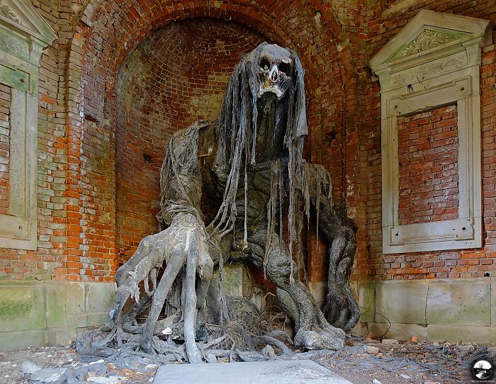 The Sculpture Of Demon In A Decaying Mausoleum In Poland