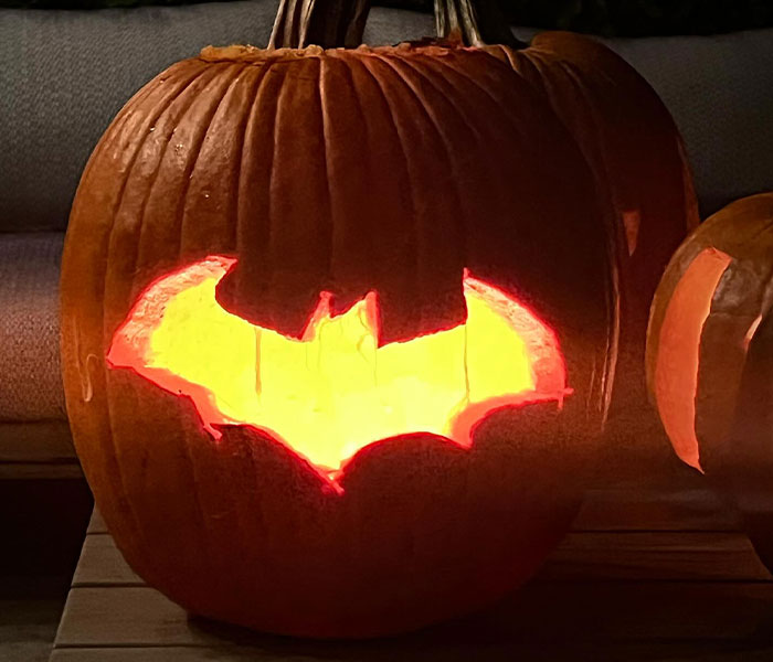Pumpkin carved with Batman symbol and glowing from inside, linked to Matthew Perry's mysterious Batman-themed posts. Pumpkin carved with Batman symbol and glowing from inside, linked to Matthew Perry's mysterious Batman-themed posts.