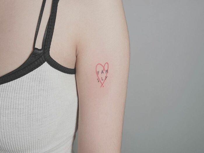 red heart with word family memorial tattoo