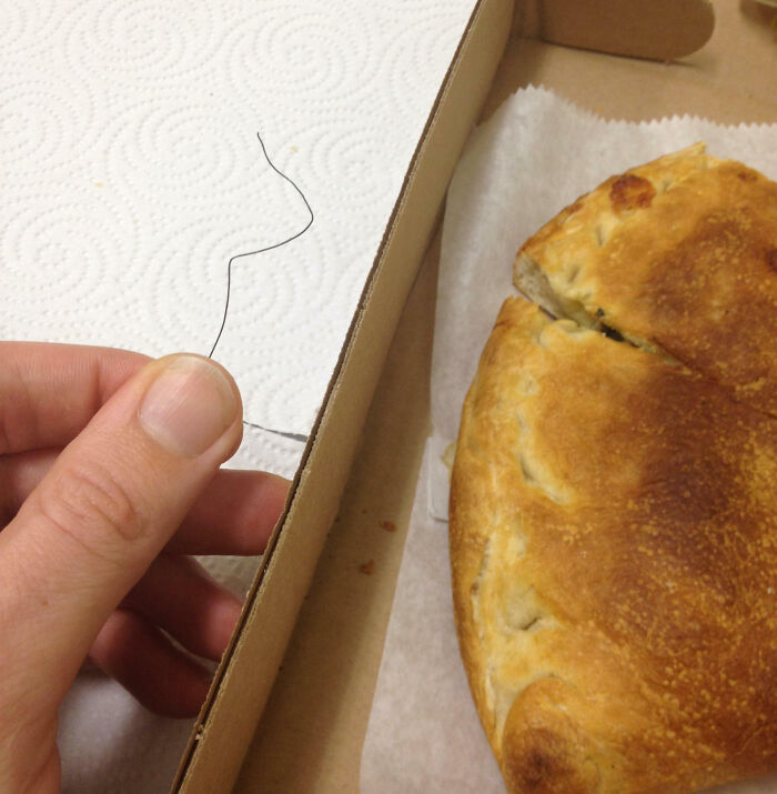 Second Bite Into My Calzone And I Found The Metal Wire From A Twist-Tie