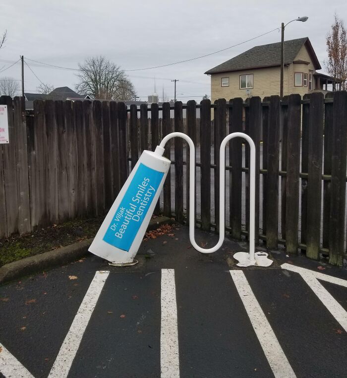 The Bike Rack At This Dentist Office Looks Like It's Being Squeezed Out Of A Tube Of Toothpaste