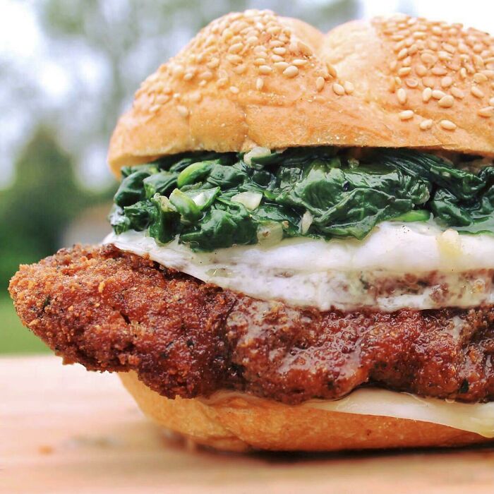Fried Chicken Cutlet Sandwich With Sharp Provolone And Sautéed Baby Spinach