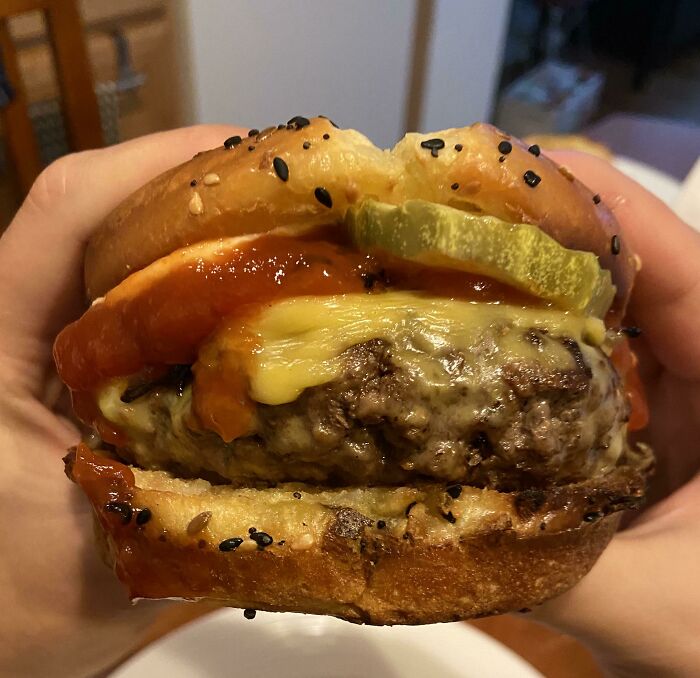 American Cheese Burger With Spicy Pickles On A Toasted Everything Bagel Brioche Bun