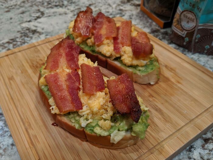 Open-Faced Avocado, Cheesy Eggs, And Bacon Sandwich On Toasted Chinese Butter Bread