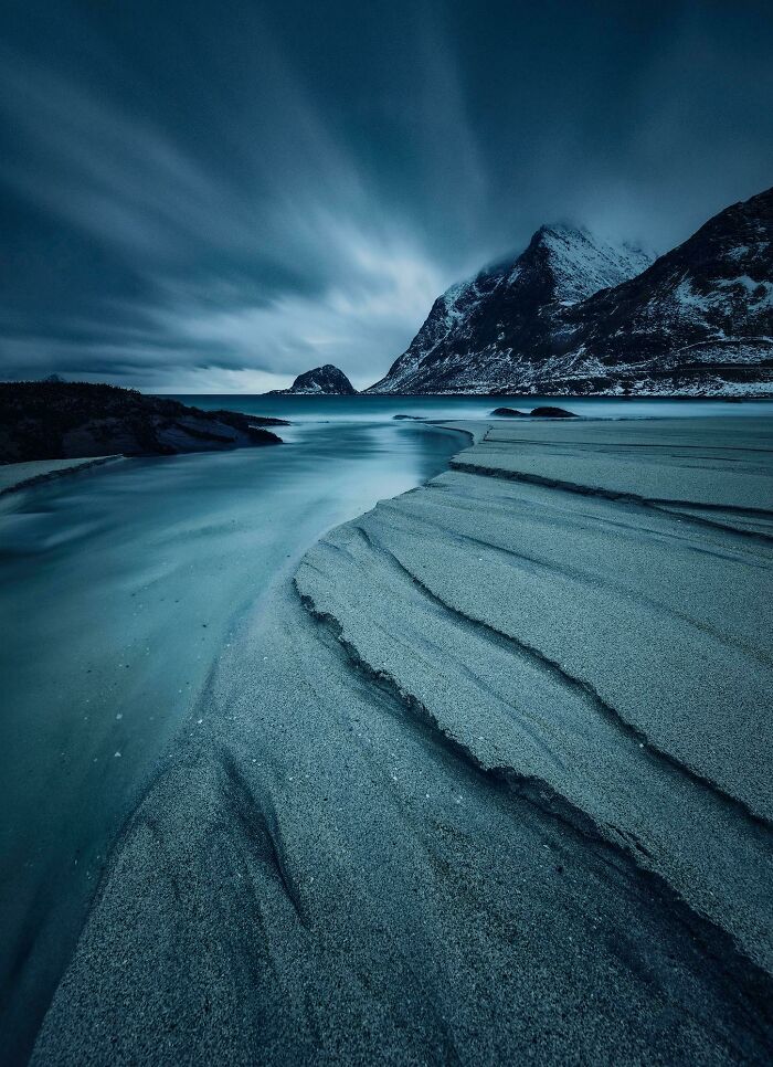 A Long Exposure In Pitch Black Darkness Reveals The Moody Side Of Haukland Beach (Lofoten) In Norway