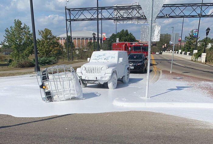 A Truck Carrying A Tank Of White Paint Dropped It On The Road
