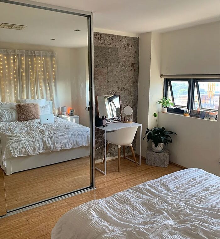 Bedroom with oversized mirror