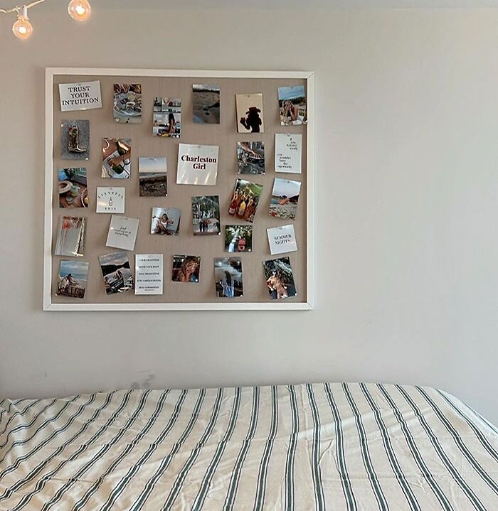 A wall-mounted pinboard hanging on bedroom wall