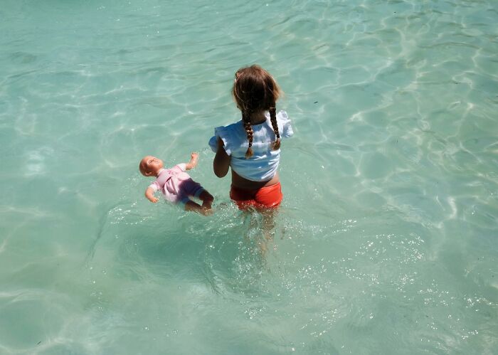 A Photograph Of A Girl In Water
