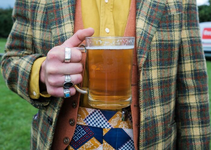 A Photograph Of A Man Holding Beer
