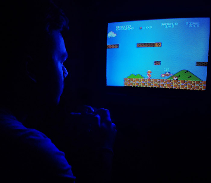 Photo of man playing Super Mario Bross