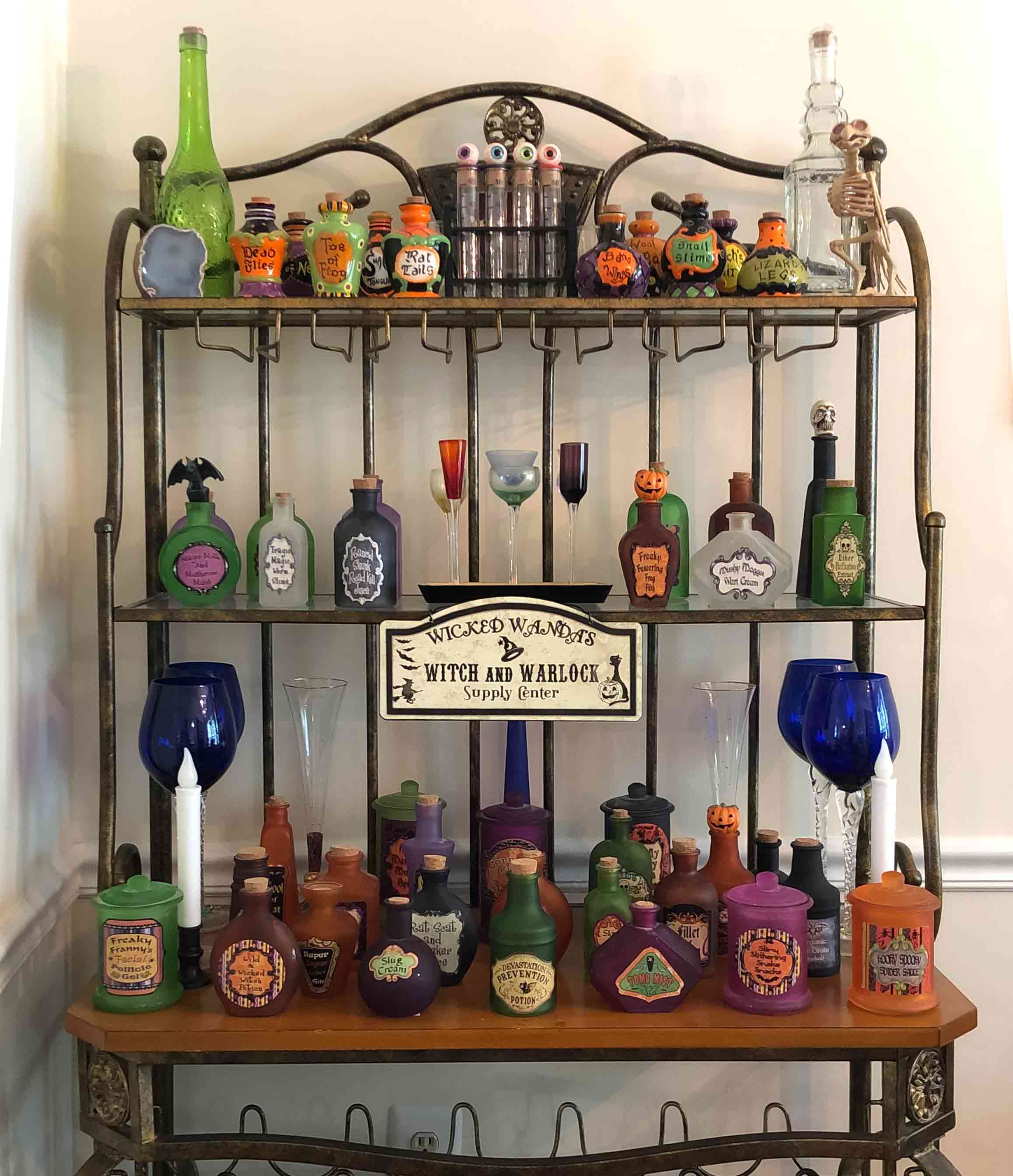 Halloween alchemy station shelf with many potions