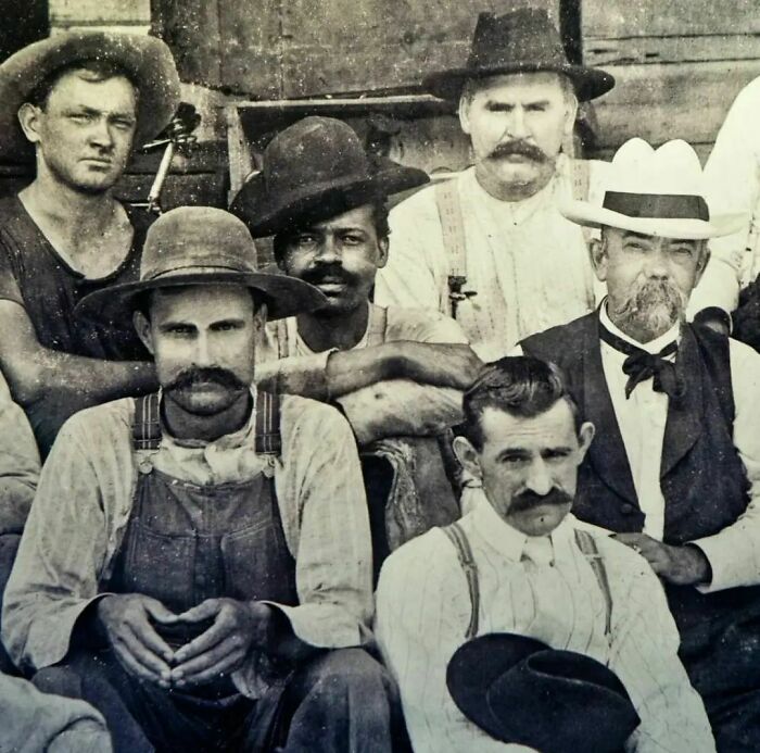 This Photo—taken At The Turn Of The Century—shows Jack Daniel (In The White Hat) Seated Next To George Green, The Son Of Nathan "Nearest" Green Who Was The First Black Master Distiller In America