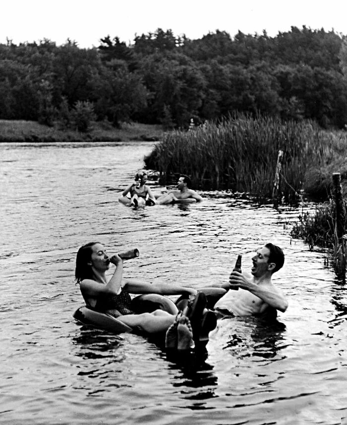 Couple Drinking Beer At Inner Tube Floating Party On The Apple River. Somerset, Wi, 1941. Photo By Alfred Eisenstaedt