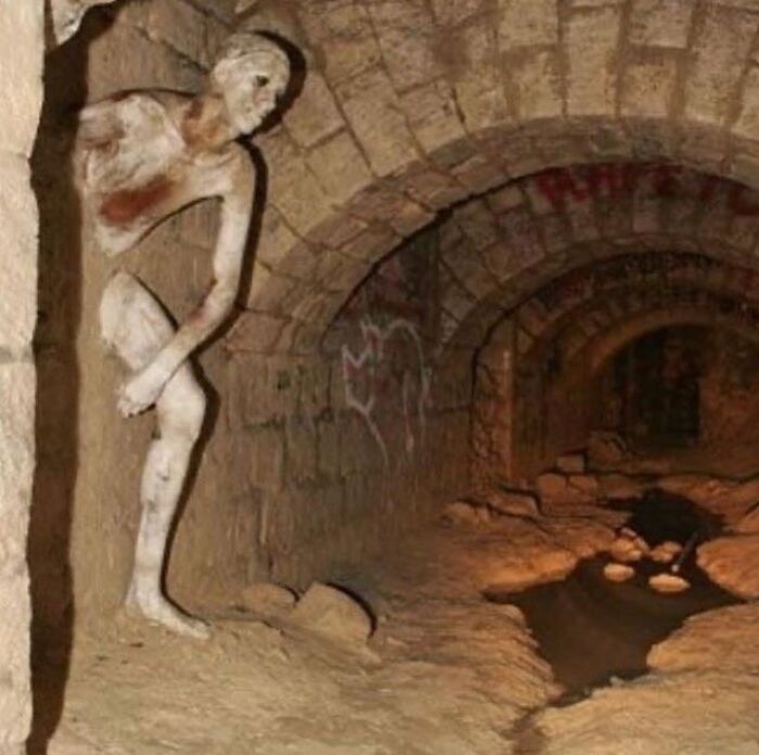 The Le Passe-Muraille (Passer-Through-Walls ) Sculpture In The Paris Catacombs