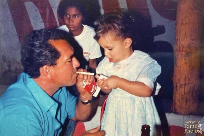 Celebrating My 2-Year-Old Birthday Party In 1988, In Brazil With My Dad And His Friends. My Dad Took The Photo While His Friend Was Teaching Me An Important Life Skill