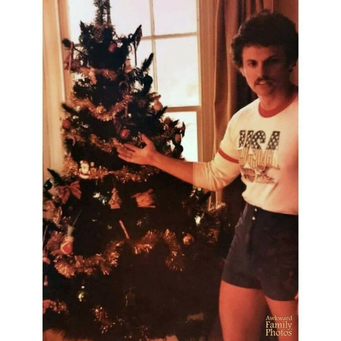 This Is My Father In 1980 In Front Of The Christmas Tree Wearing His Favorite Pair Of Shorts (That He Had In Several Different Colors)