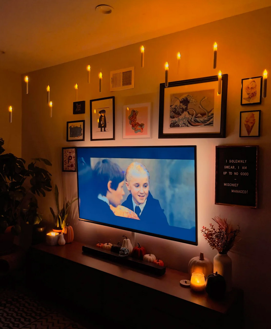 Floating candles and Harry Potter on TV in the living room