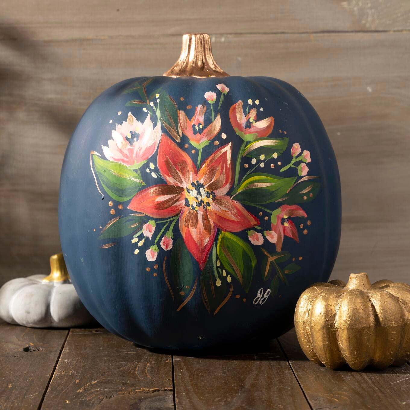 Blue painted pumpkin with flowers