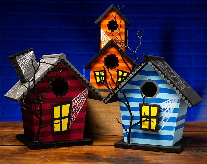 Three painted haunted birdhouses