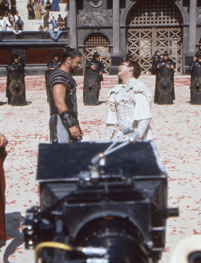 Russel Crowe And Joaquin Phoenix Sharing A Joke While Filming Their Final Duel For Gladiator