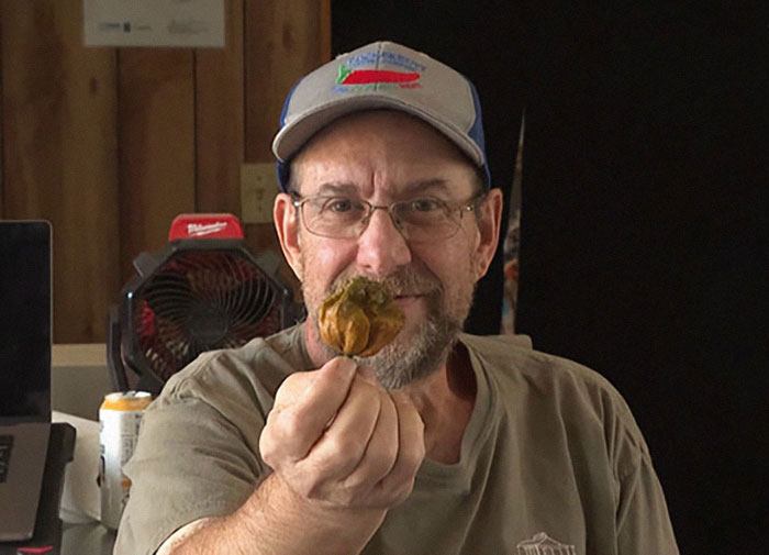 Man Crossbreeds Carolina Reaper With "Brutally Hot" Mystery Pepper, Beats His Own Guinness World Record