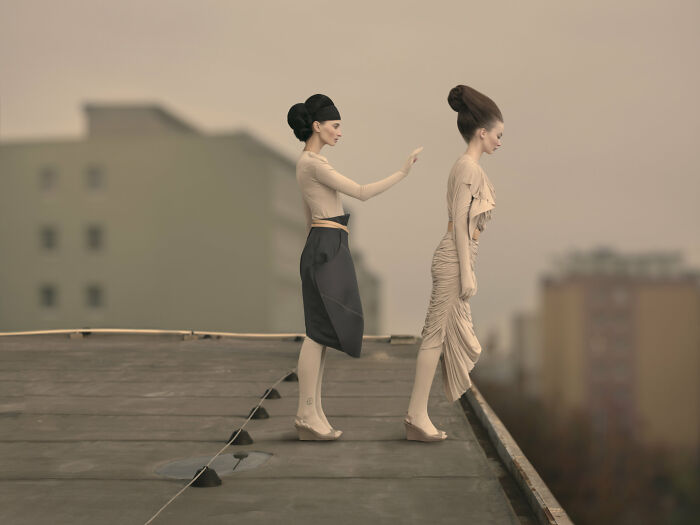 An image of two women on the roof