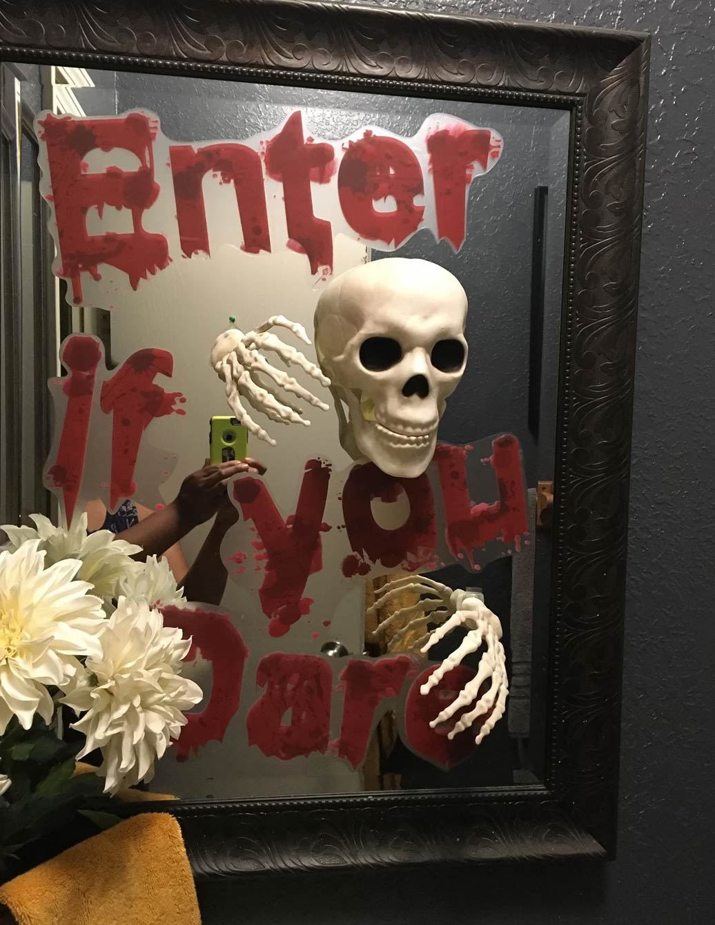 Halloween mirror decoration with skeleton, flowers and bloody letters