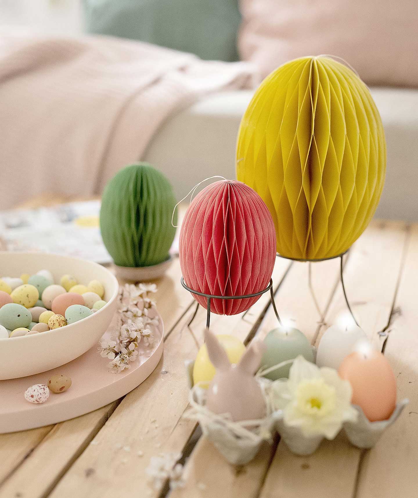 Table decorated with colorful paper eggs