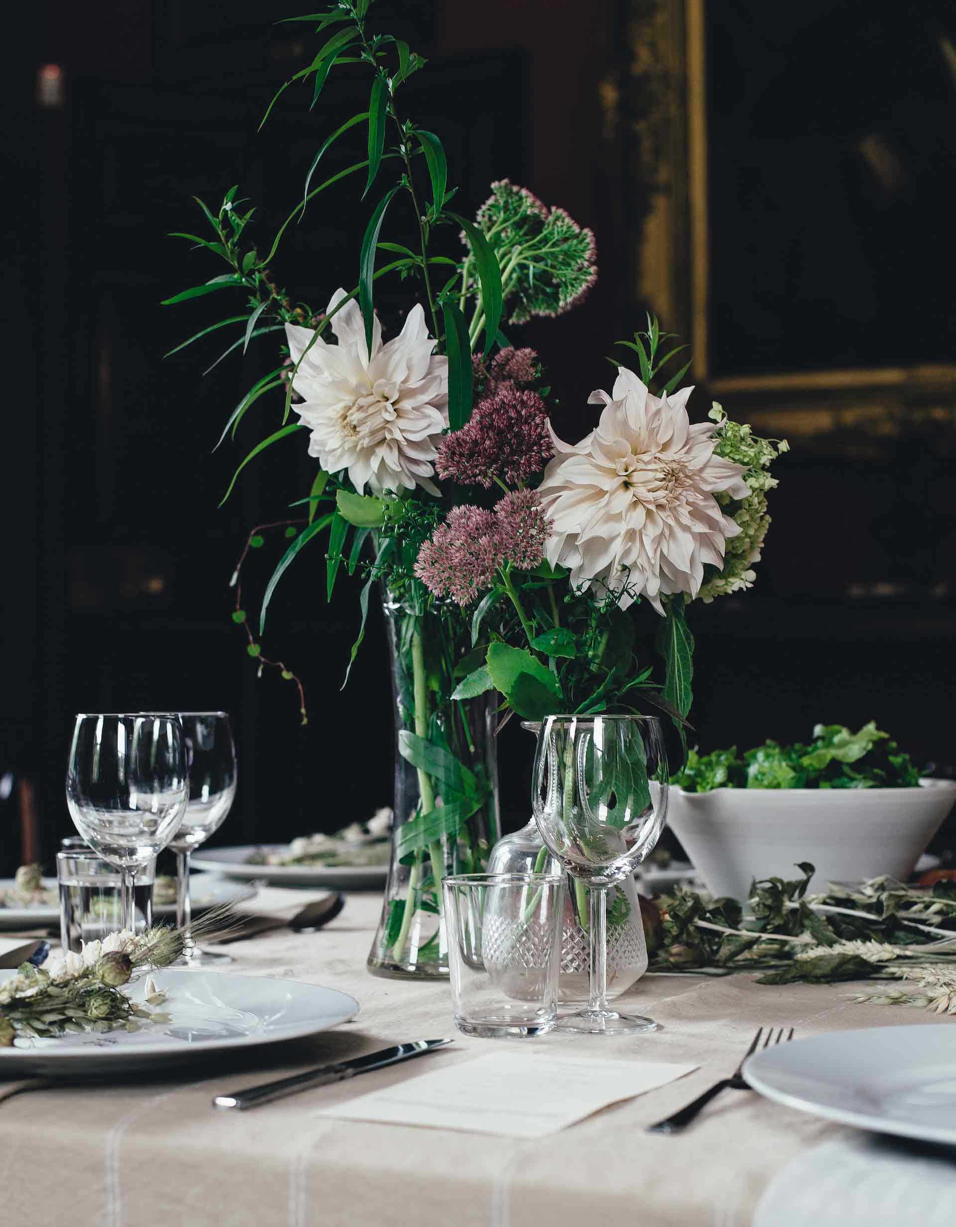 Elegant dinner table with tableware and flowers