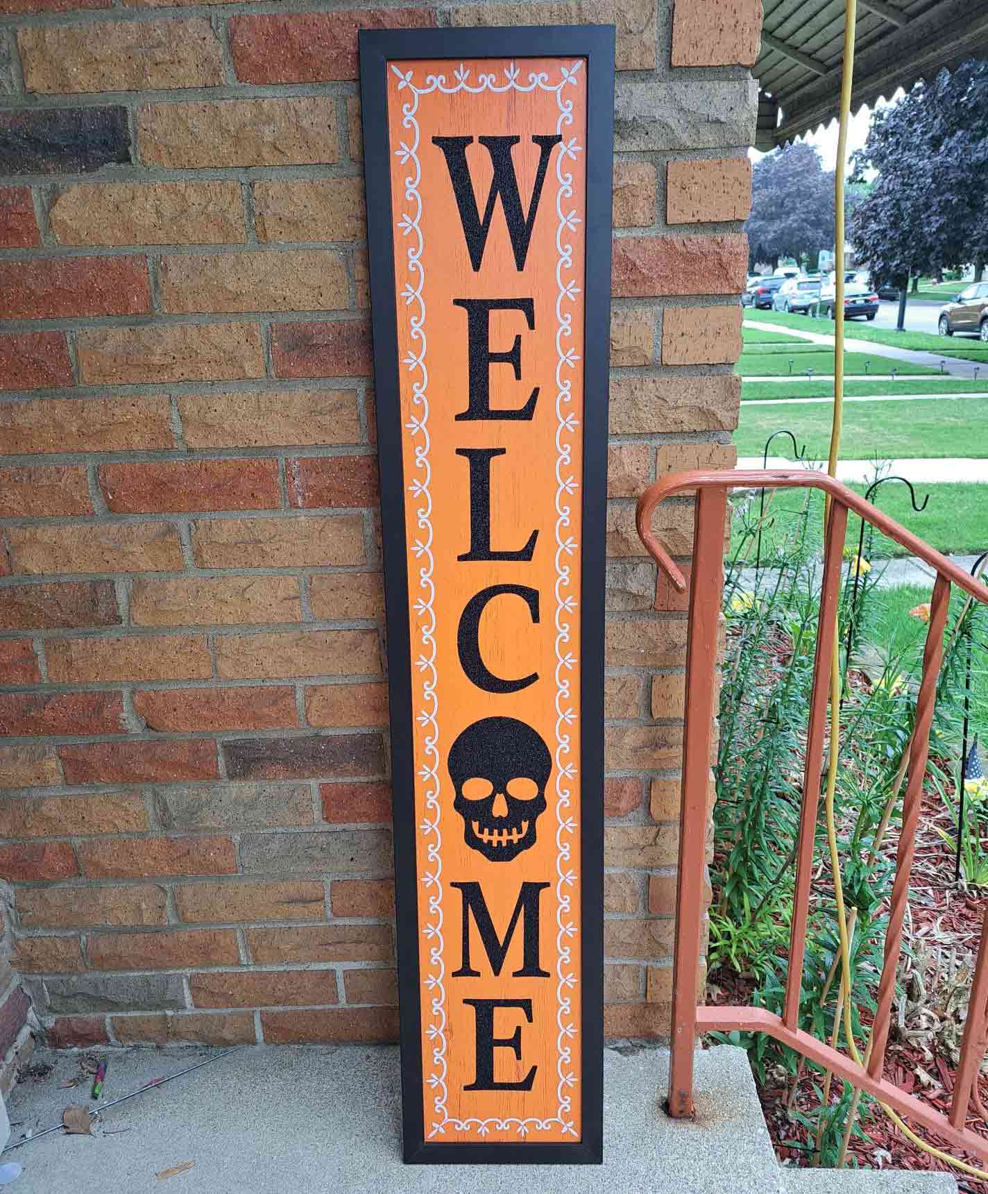 Orange and black welcome sign