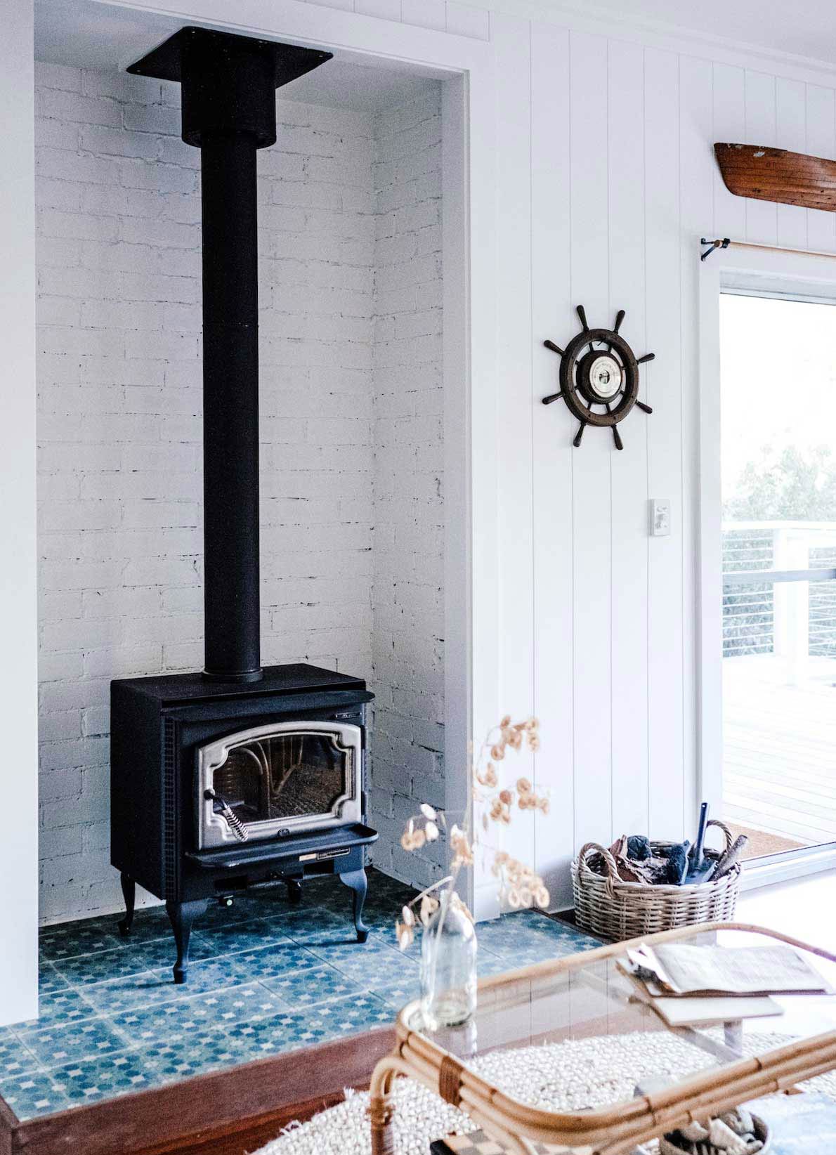 Small wood-burning stove in white marine interior
