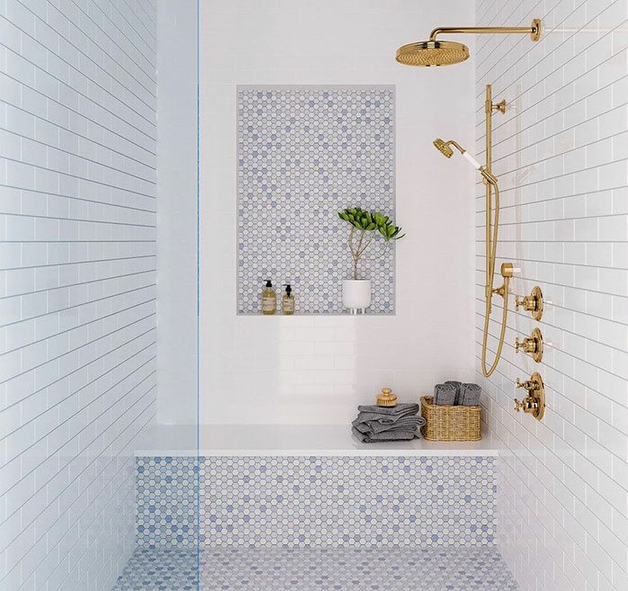 blue and white bathroom with mosaic and penny tiles