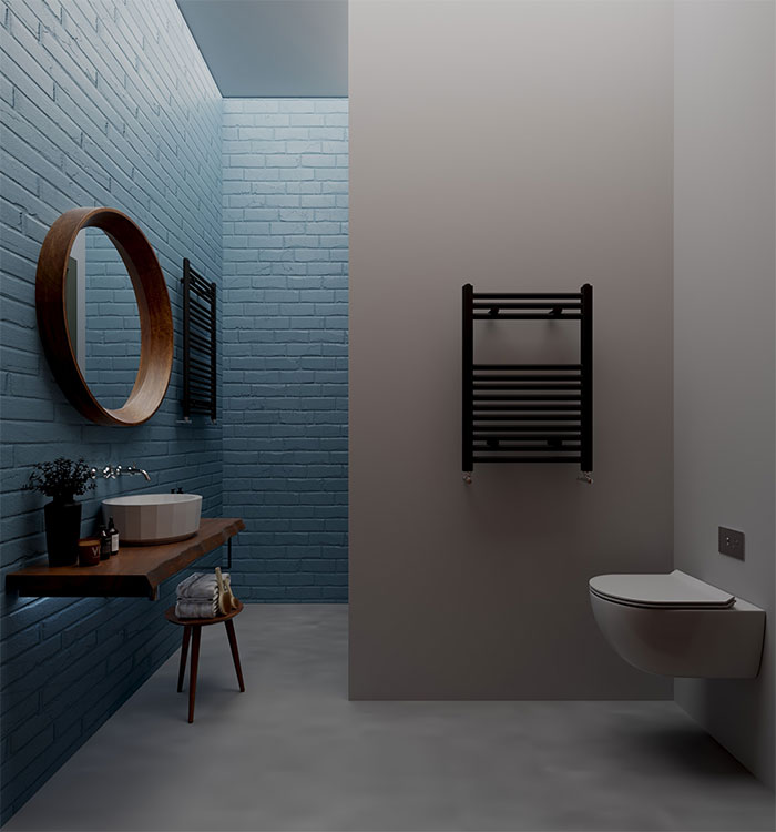 a bathroom with a toilet, sink, and mirror with rectangular blue tiles