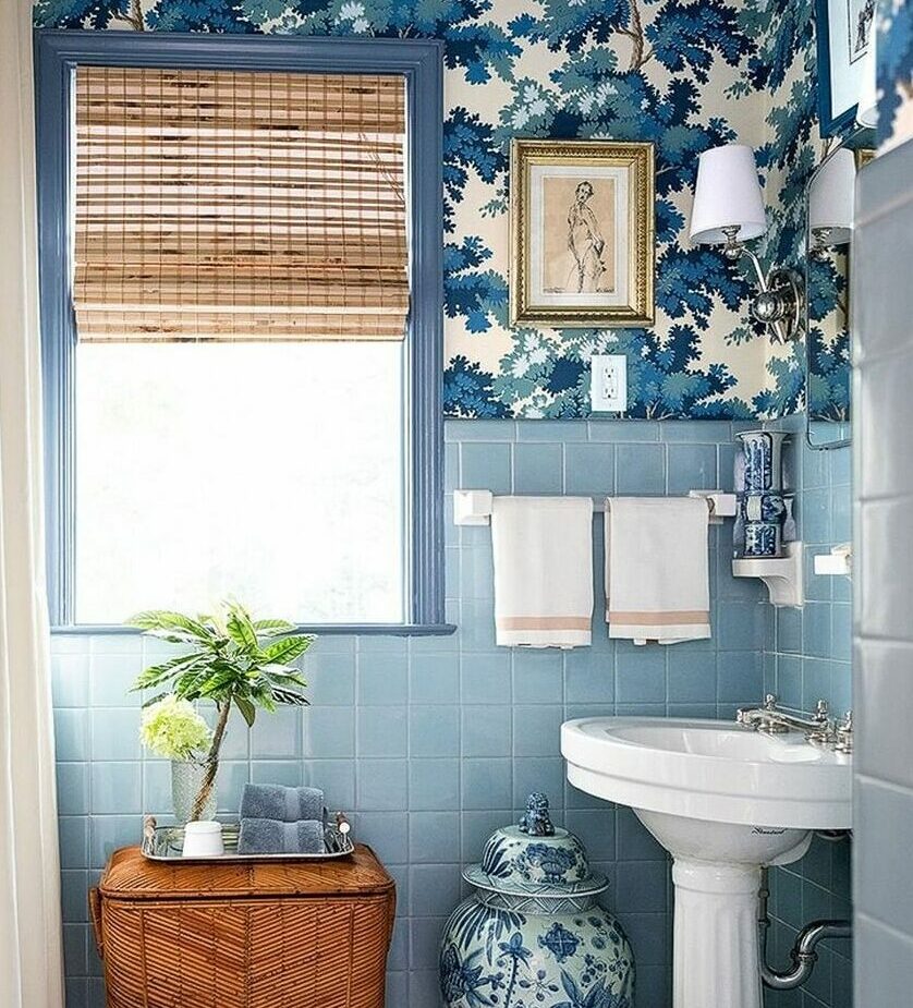 bathroom with blue tiles and flower wallpaper